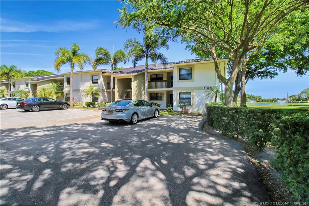 Photo of 12870 Briarlake Drive #204, Palm Beach Gardens, FL 33418 (MLS # M20044140)