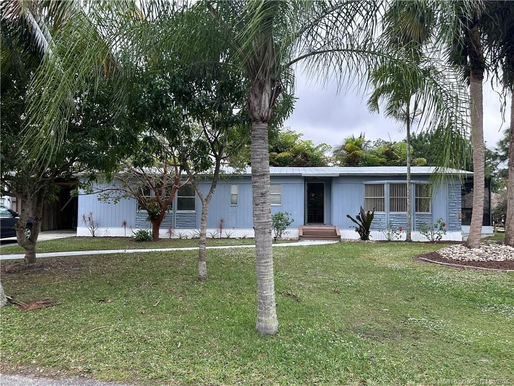 Photo of 7802 SE Paradise Drive, Stuart, FL 34997 (MLS # M20048171)