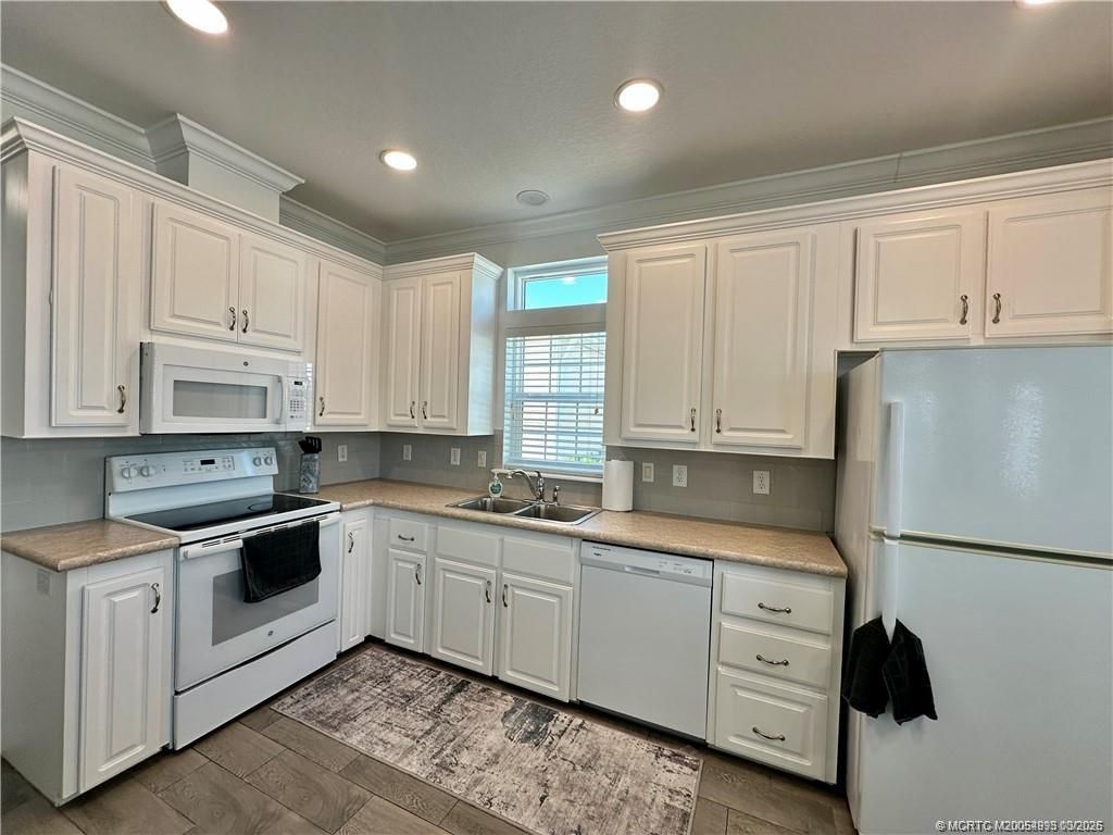 Photo of 138 NE Coastal Drive, Jensen Beach, FL 34957 (MLS # M20054993)