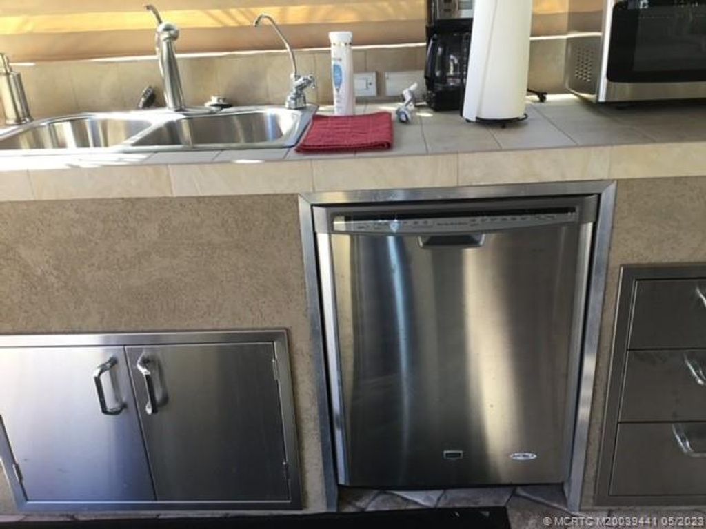 Photo of 441 NW Sandtrap Lane, Port Saint Lucie, FL 34986 (MLS # M20039441)