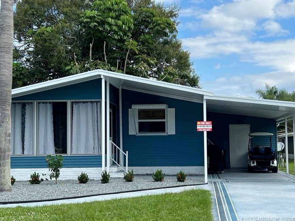 Photo of 16373 Indianwood Cir Center, Indiantown, FL 34956 (MLS # M20052796)