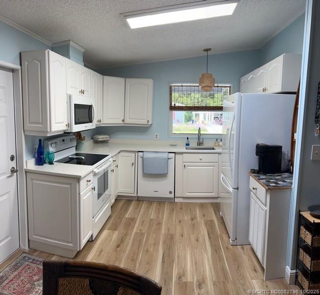 Photo of 16373 Indianwood Cir Center, Indiantown, FL 34956 (MLS # M20052796)