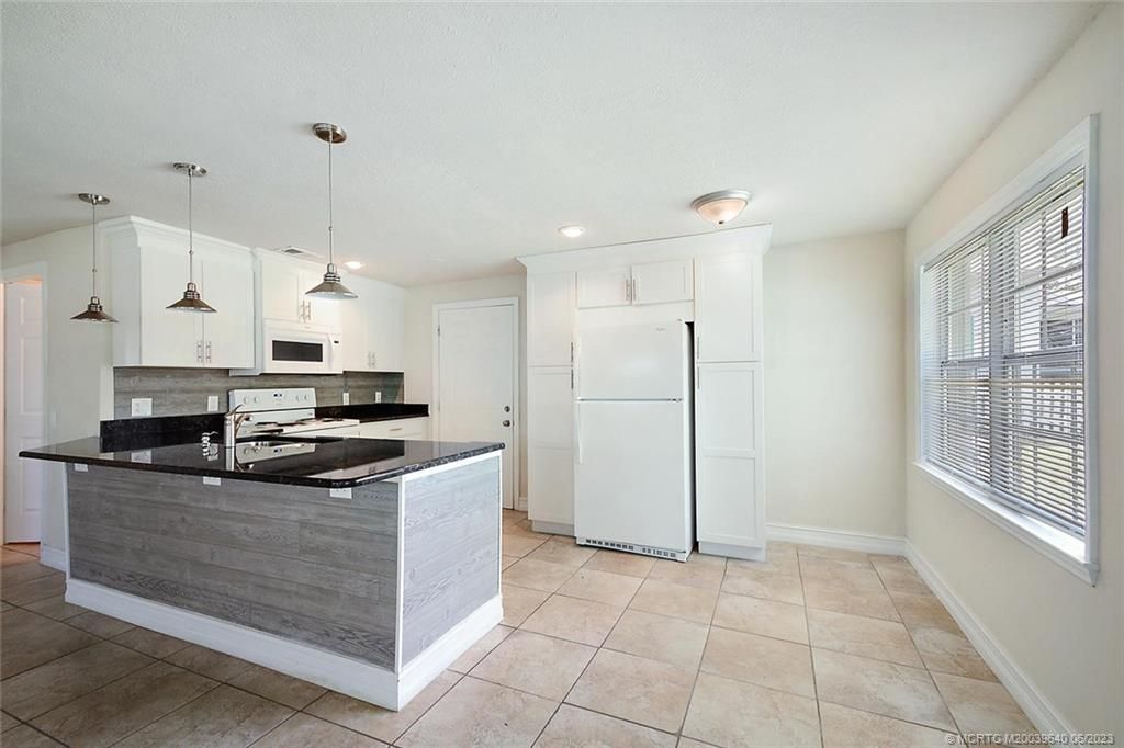 Photo of 1048 SW 30th Street, Palm City, FL 34990 (MLS # M20039640)