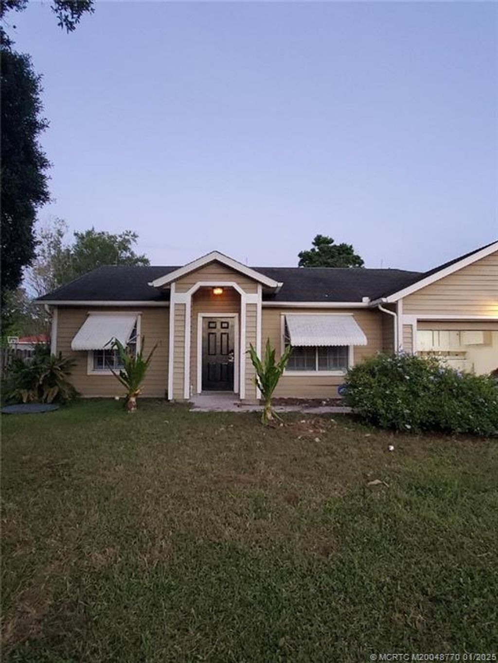 Photo of 4425 SW Cacao Street, Port Saint Lucie, FL 34953 (MLS # M20048770)