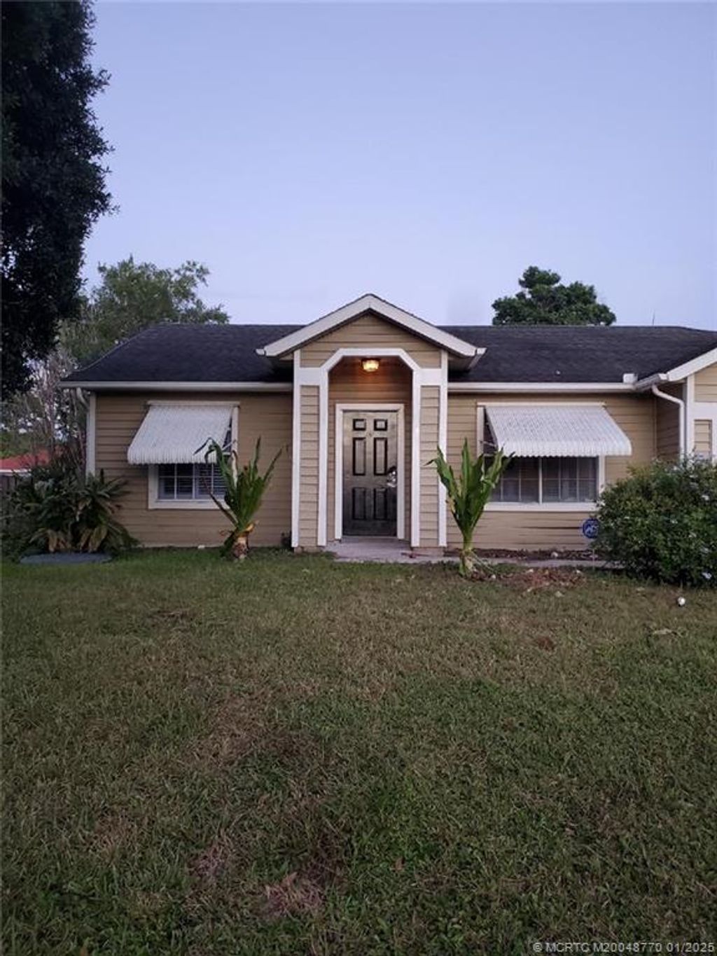 Photo of 4425 SW Cacao Street, Port Saint Lucie, FL 34953 (MLS # M20048770)