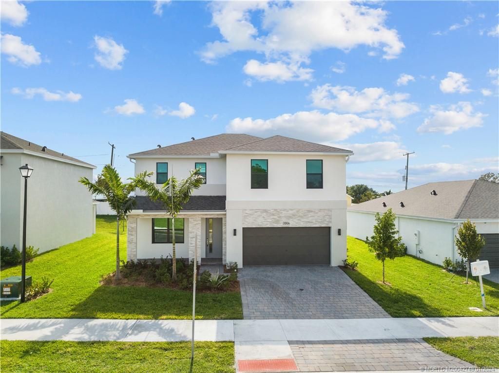 Photo of 2006 NE Ocean Dunes Drive, Jensen Beach, FL 34957 (MLS # M20042749)