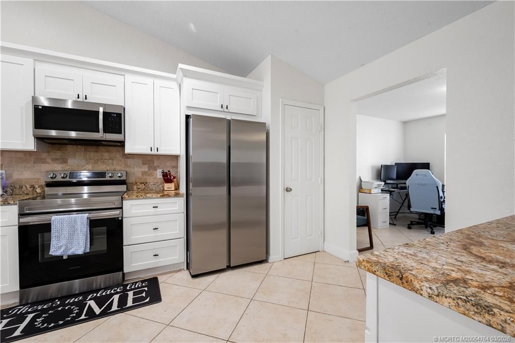 Photo of 870 SW Mccoy Avenue, Port Saint Lucie, FL 34953 (MLS # M20054764)