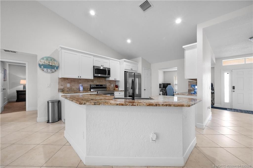 Photo of 870 SW Mccoy Avenue, Port Saint Lucie, FL 34953 (MLS # M20054764)