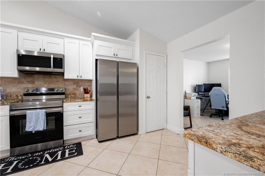 Photo of 870 SW Mccoy Avenue, Port Saint Lucie, FL 34953 (MLS # M20054764)