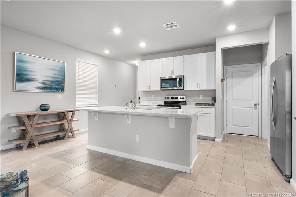 Photo of 156 Osprey Preserve BLVD, Jensen Beach, FL 34957 (MLS # M20054799)