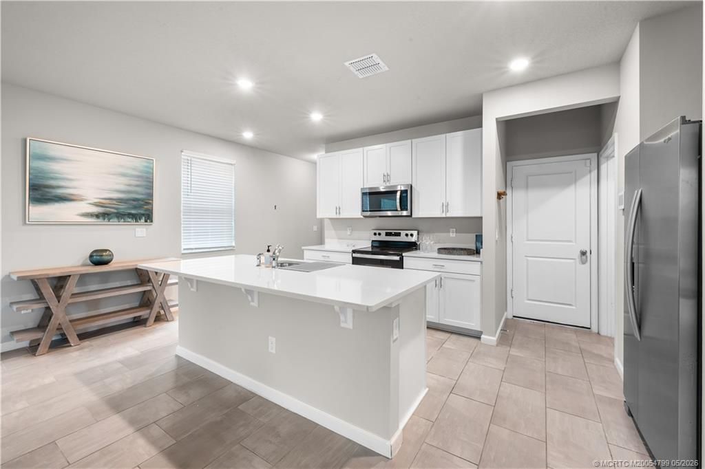 Photo of 156 Osprey Preserve BLVD, Jensen Beach, FL 34957 (MLS # M20054799)
