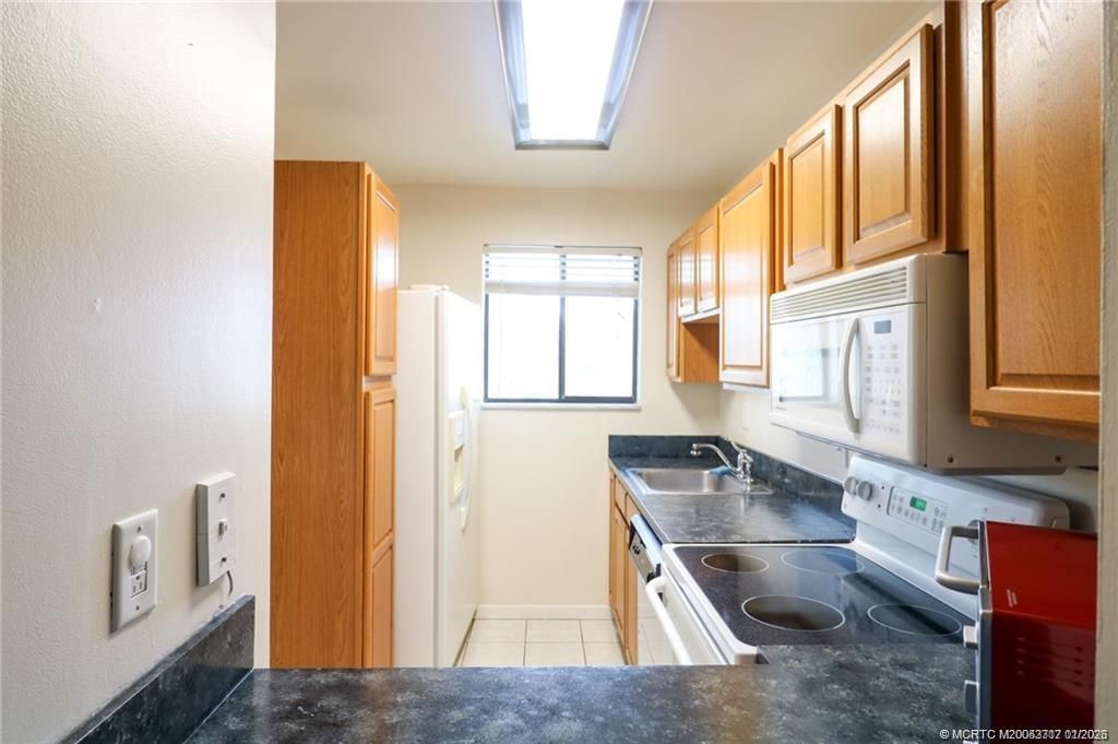 Photo of 5433 SE Miles Grant Road #203, Stuart, FL 34997 (MLS # M20053717)