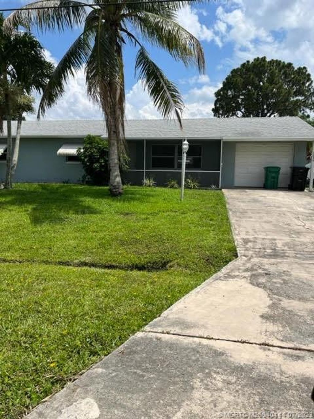 Photo of 1234 SE Petunia Avenue, Port Saint Lucie, FL 34952 (MLS # M20040144)