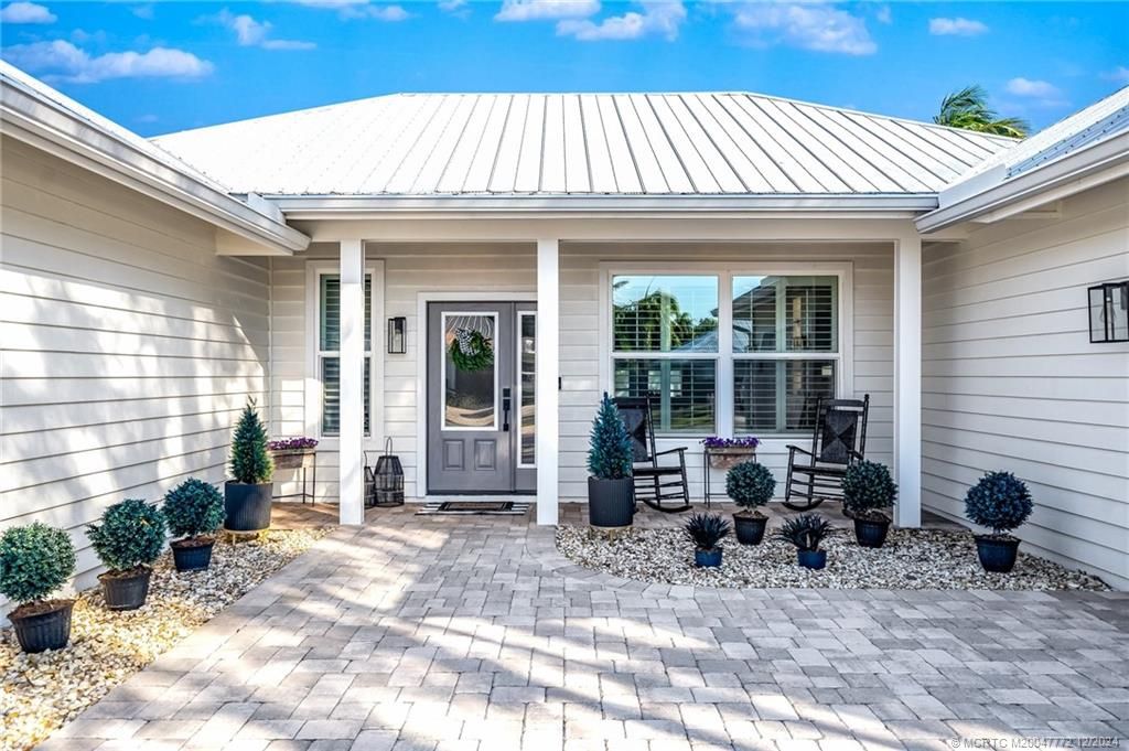 Photo of 1928 SW Hunters Club Way, Palm City, FL 34990 (MLS # M20047772)