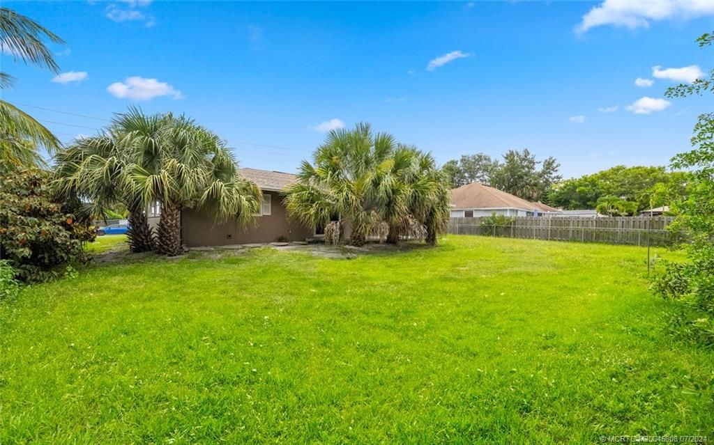 Photo of 2374 SW Woodridge Street, Port Saint Lucie, FL 34953 (MLS # M20045808)