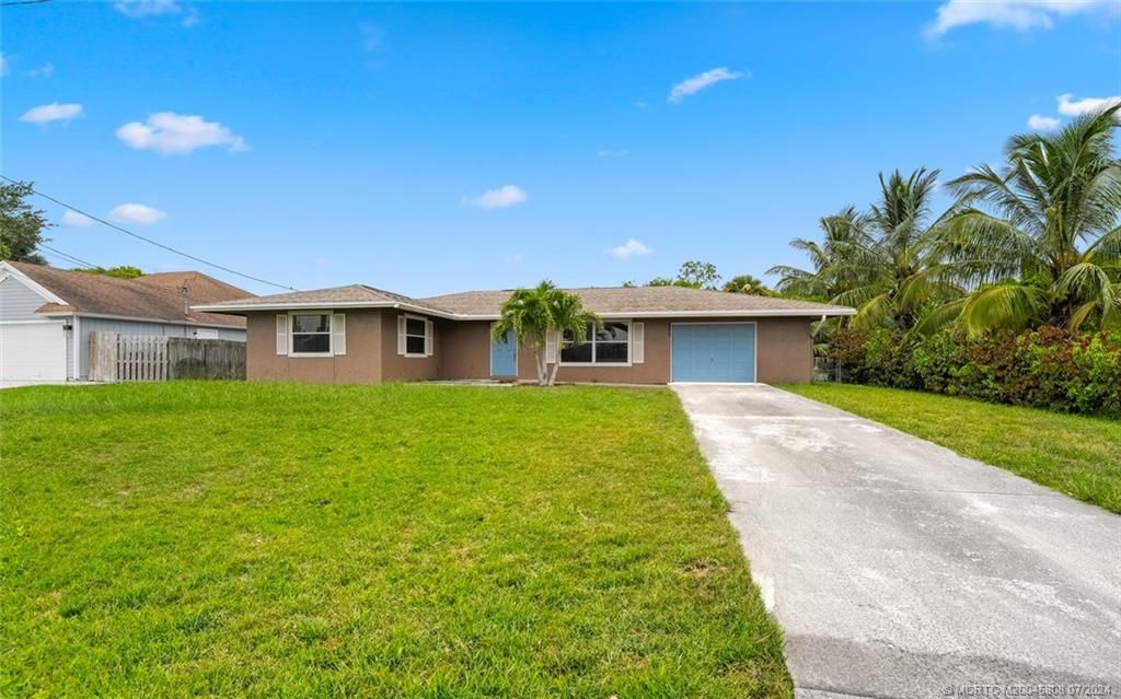 Photo of 2374 SW Woodridge Street, Port Saint Lucie, FL 34953 (MLS # M20045808)