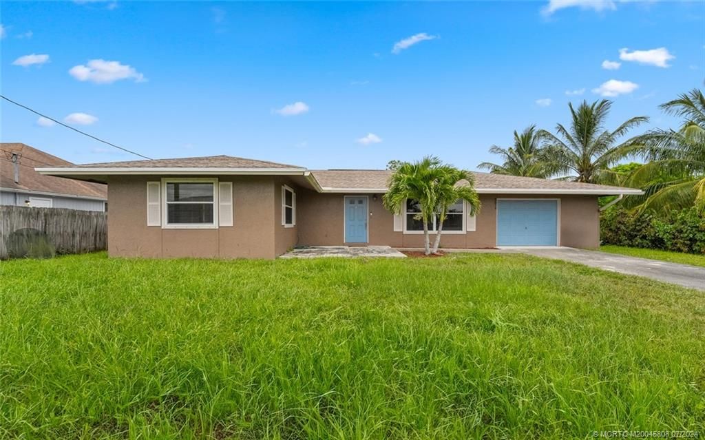 Photo of 2374 SW Woodridge Street, Port Saint Lucie, FL 34953 (MLS # M20045808)