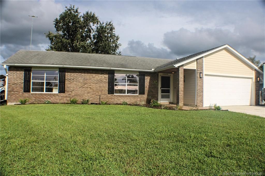 Photo of 337 NW Dearman Street, Port Saint Lucie, FL 34983 (MLS # M20051918)