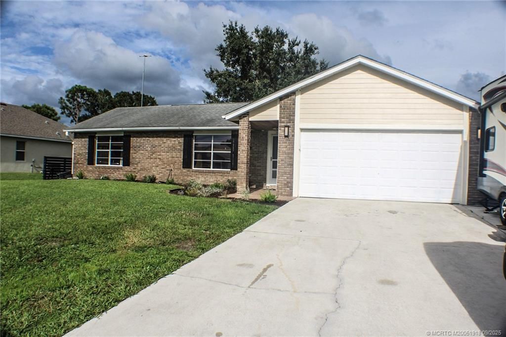 Photo of 337 NW Dearman Street, Port Saint Lucie, FL 34983 (MLS # M20051918)