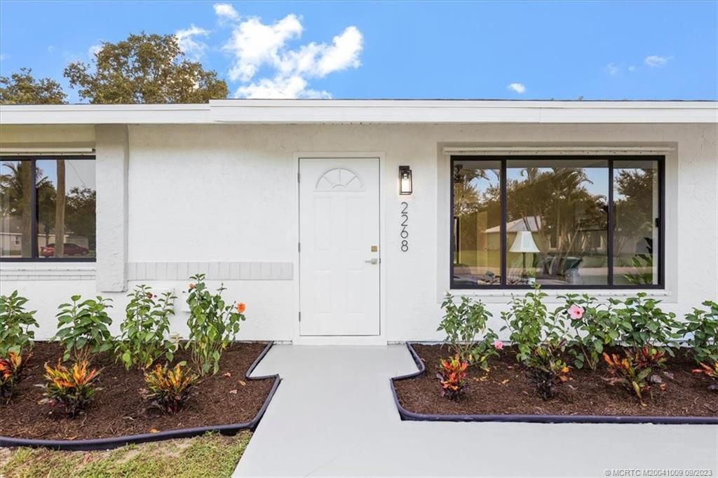 Photo of 2268 SE Trillo Street, Port Saint Lucie, FL 34952 (MLS # M20041009)