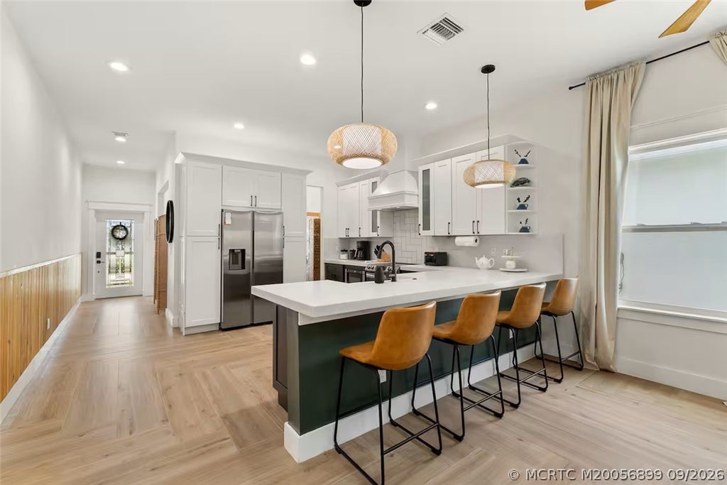 Photo of 1920 NE Dixie Highway, Jensen Beach, FL 34957 (MLS # M20056899)