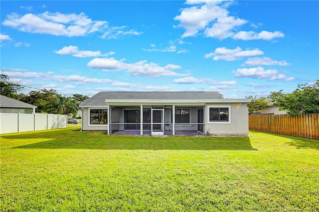 Photo of 2198 SE Aneci Street, Port Saint Lucie, FL 34984 (MLS # M20041344)