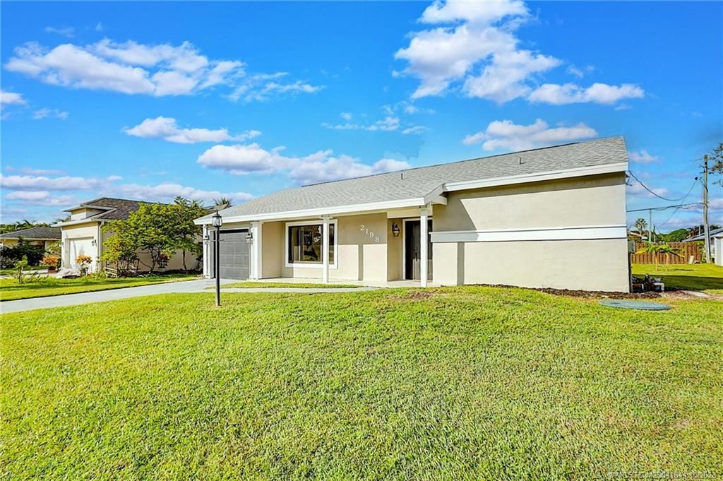 Photo of 2198 SE Aneci Street, Port Saint Lucie, FL 34984 (MLS # M20041344)