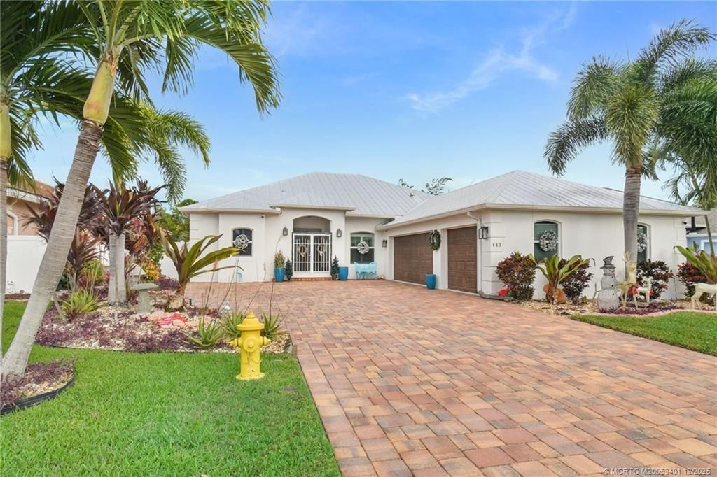 Photo of 443 NW Sunflower Place, Jensen Beach, FL 34957 (MLS # M20053401)