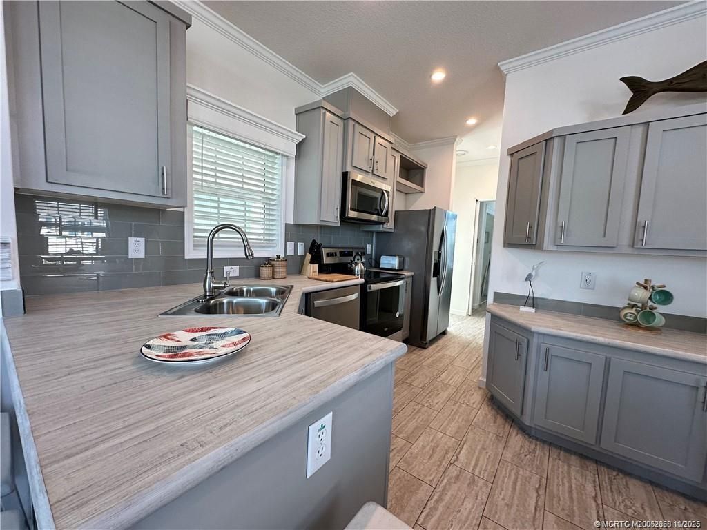 Photo of 219 NE Sunrise, Jensen Beach, FL 34957 (MLS # M20052860)