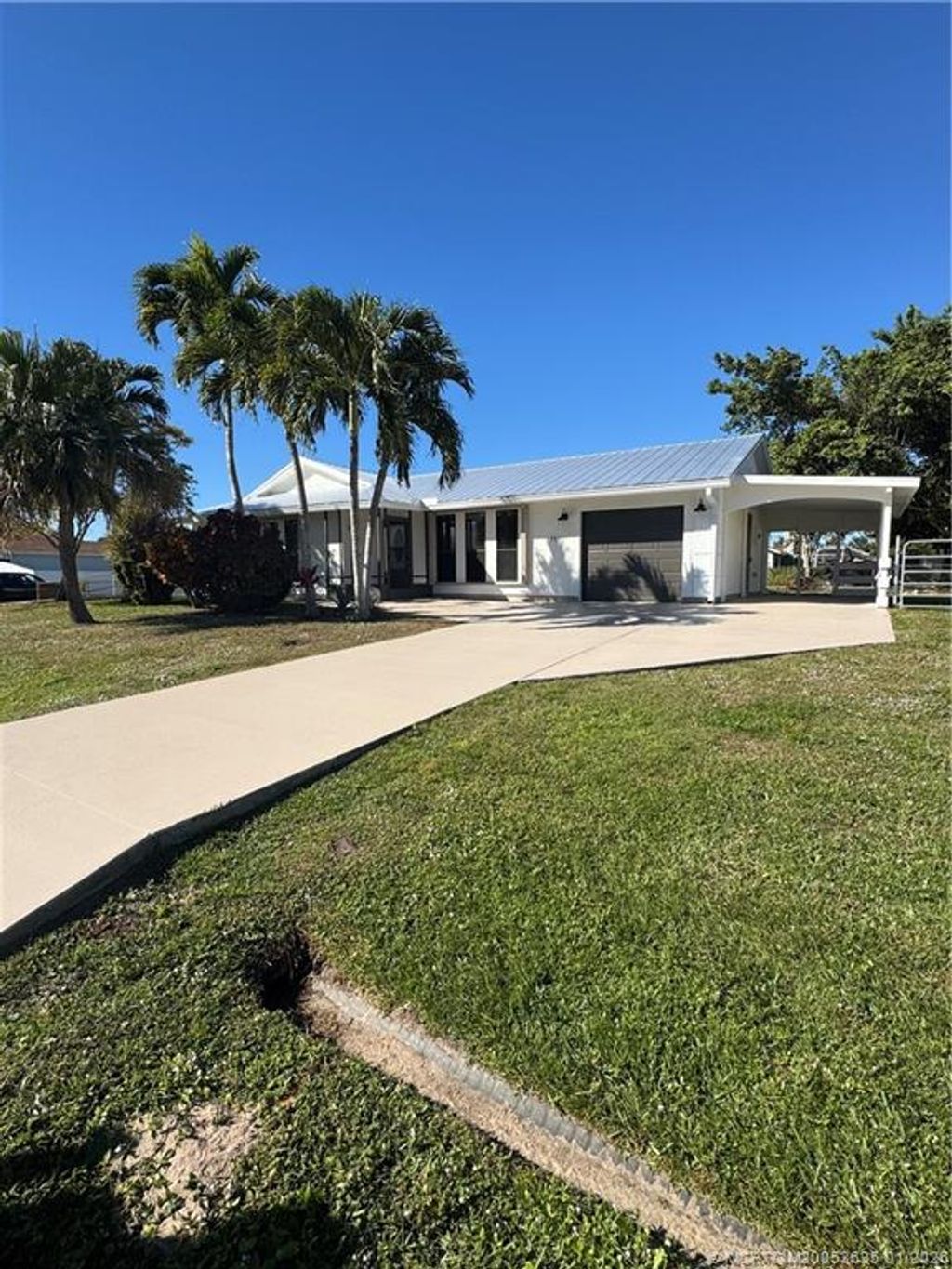Photo of 981 SW Bay State Road, Port Saint Lucie, FL 34953 (MLS # M20053635)