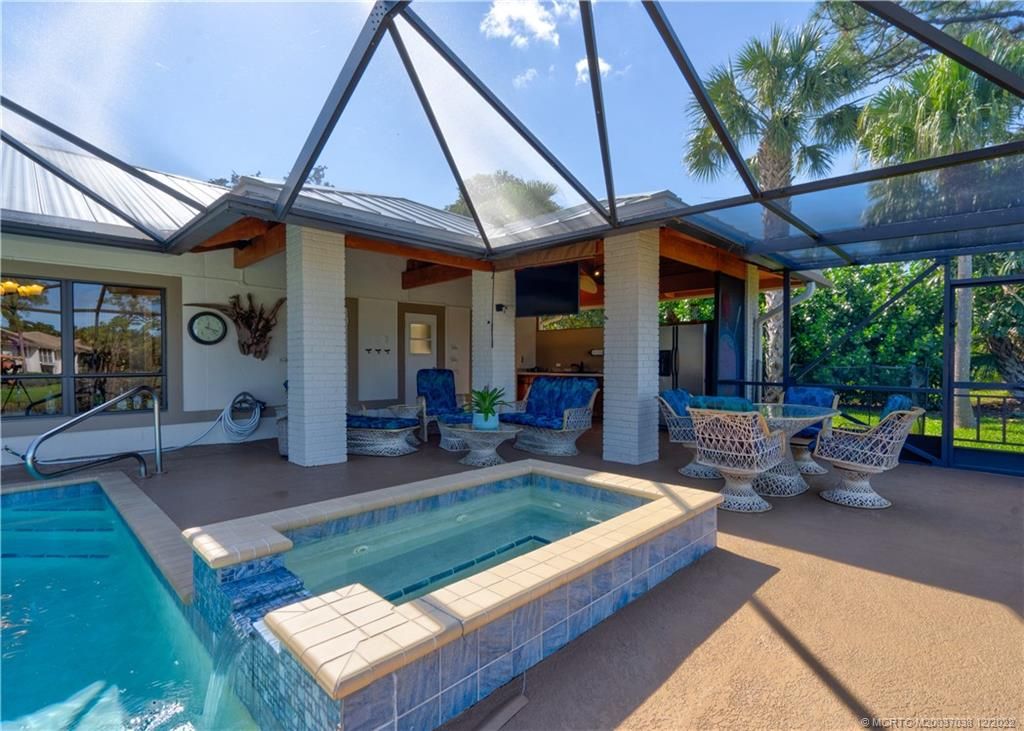 Photo of 1313 SW Troon Circle, Palm City, FL 34990 (MLS # M20037038)