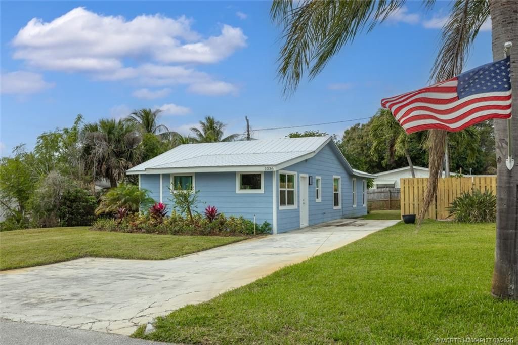 Photo of 1036 NE Wright Avenue, Jensen Beach, FL 34957 (MLS # M20049177)