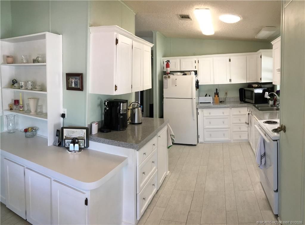 Photo of 16300 Indianwood Circle SW, Indiantown, FL 34956 (MLS # M20053997)