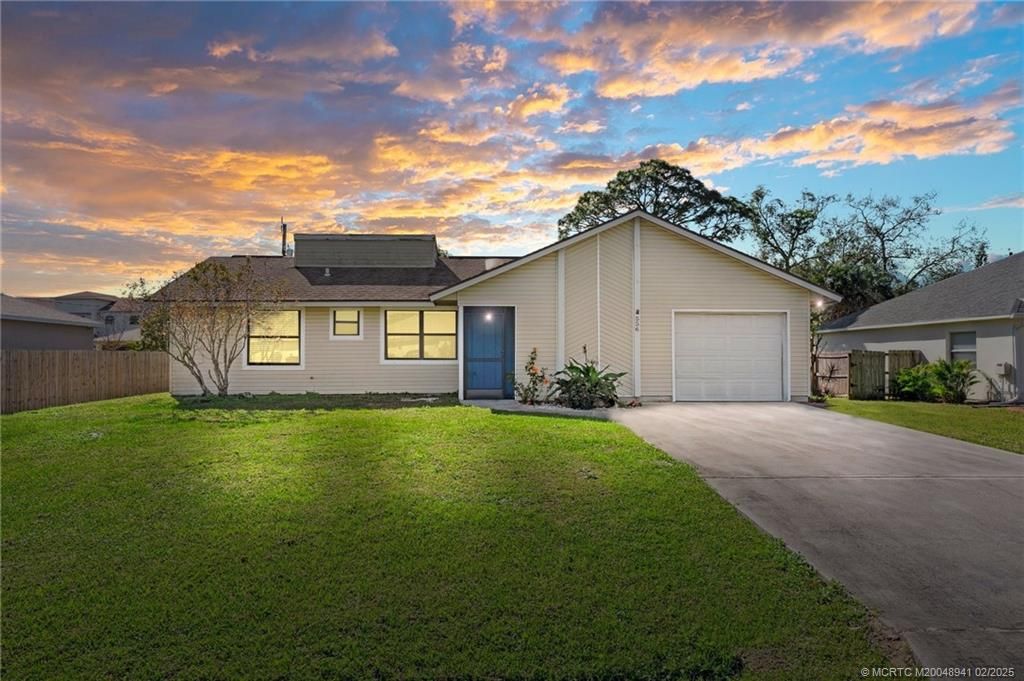 Photo of 556 NW Azine Avenue, Port Saint Lucie, FL 34983 (MLS # M20048941)