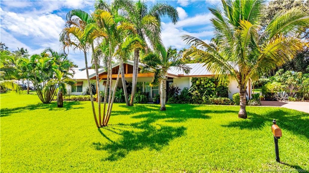 Photo of 1964 NE Lake Place, Jensen Beach, FL 34957 (MLS # M20052093)