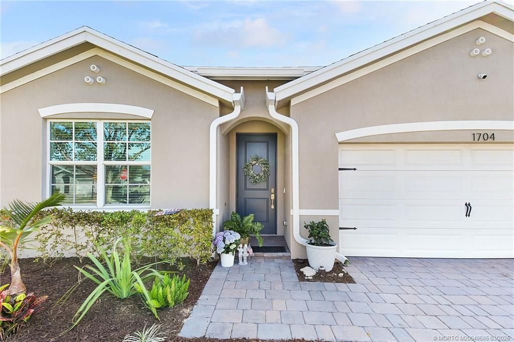 Photo of 1704 NE White Pine Terrace, Jensen Beach, FL 34957 (MLS # M20049585)