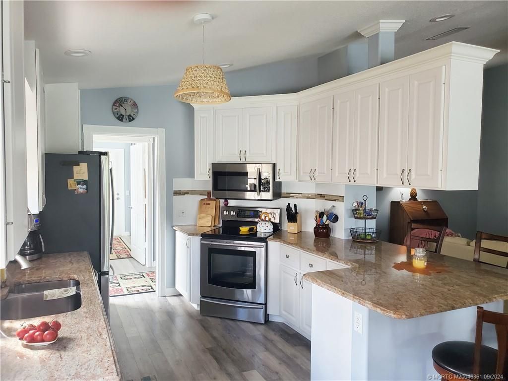 Photo of 8441 SE Retreat Drive, Hobe Sound, FL 33455 (MLS # M20046861)