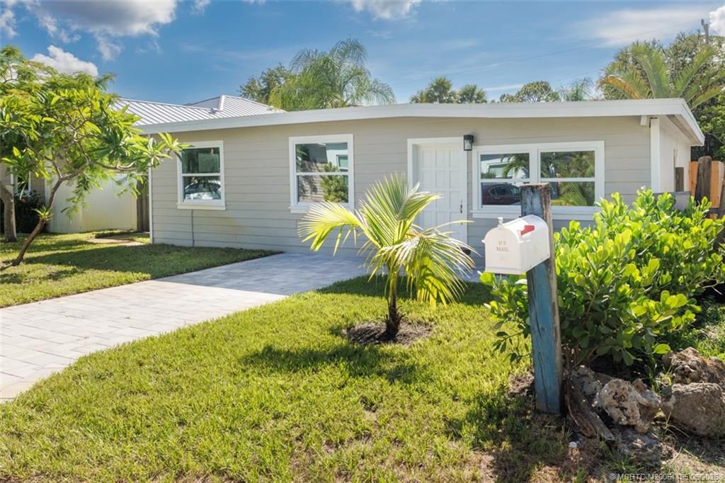 Photo of 1073 NE Orange Avenue, Jensen Beach, FL 34957 (MLS # M20051195)