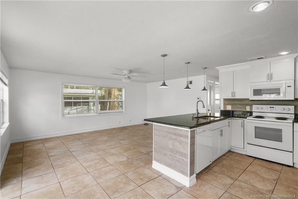 Photo of 1048 SW 30th Street, Palm City, FL 34990 (MLS # M20043162)