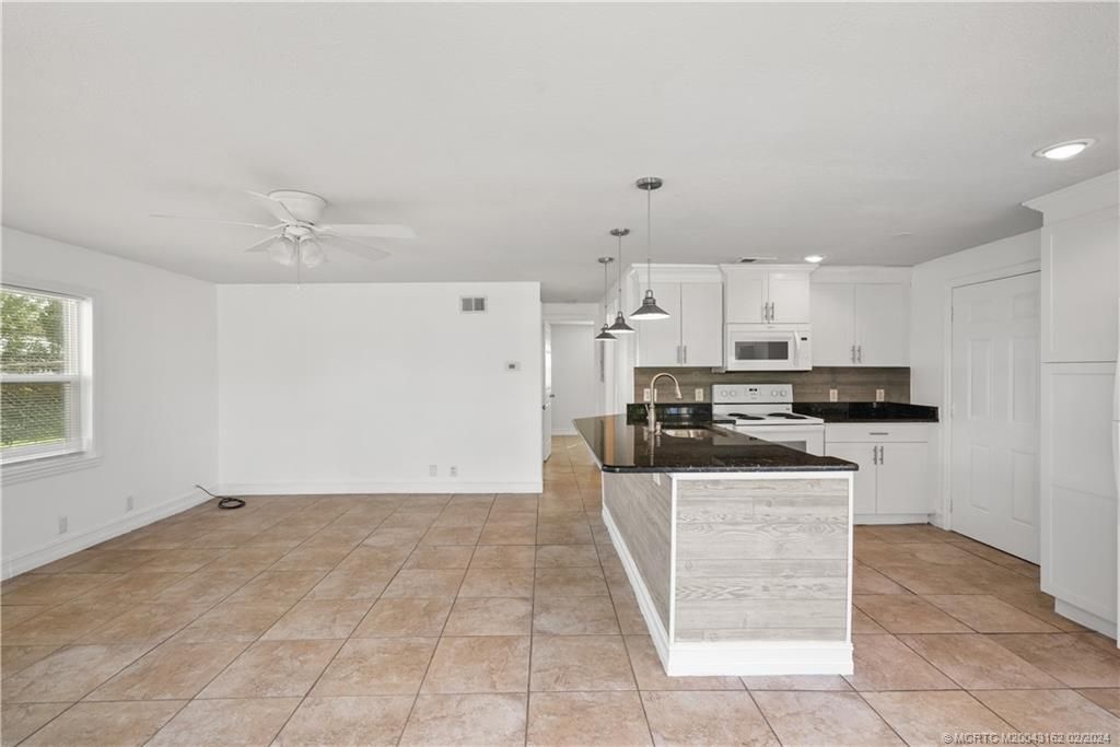 Photo of 1048 SW 30th Street, Palm City, FL 34990 (MLS # M20043162)