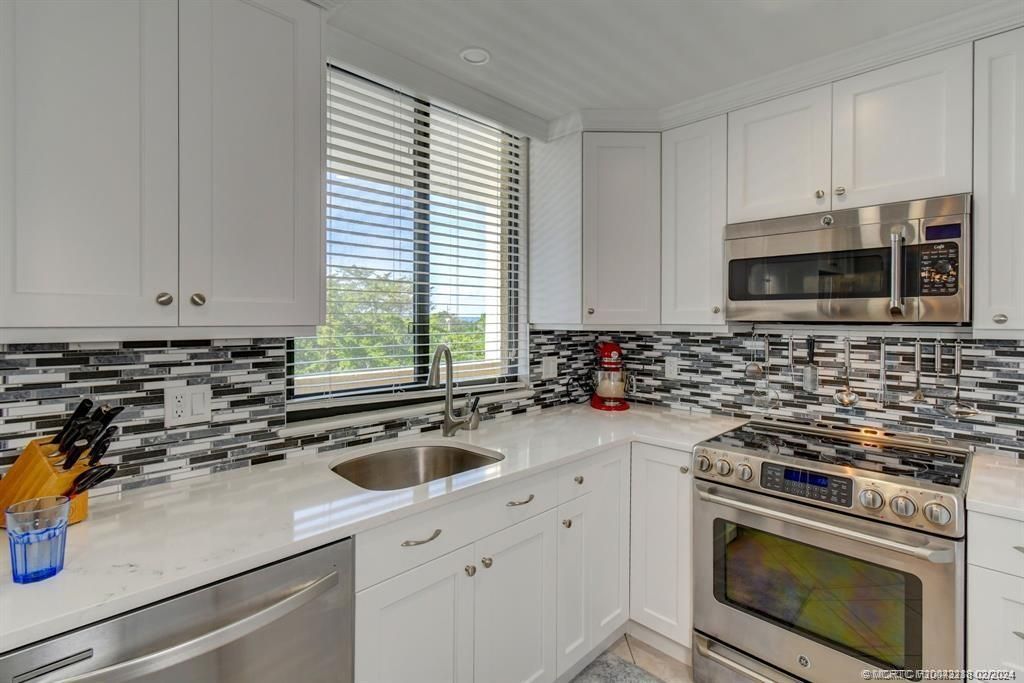 Photo of 3412 NE Causeway Boulevard #403, Jensen Beach, FL 34957 (MLS # M20043218)