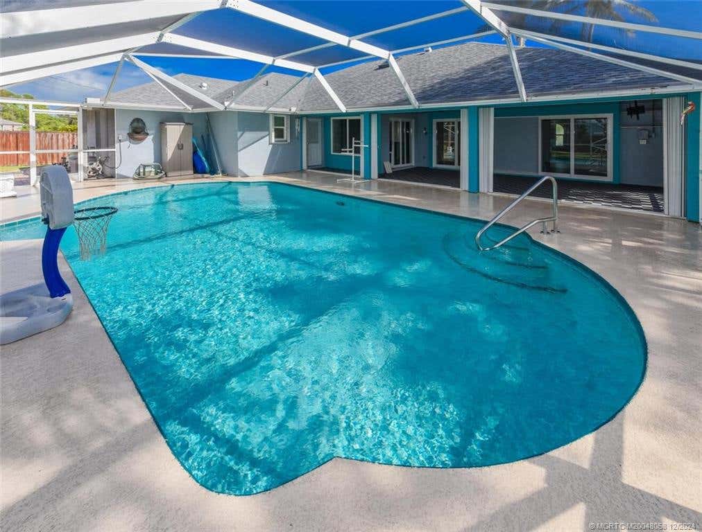 Photo of 2292 SE Rock Springs Drive, Port Saint Lucie, FL 34952 (MLS # M20048058)
