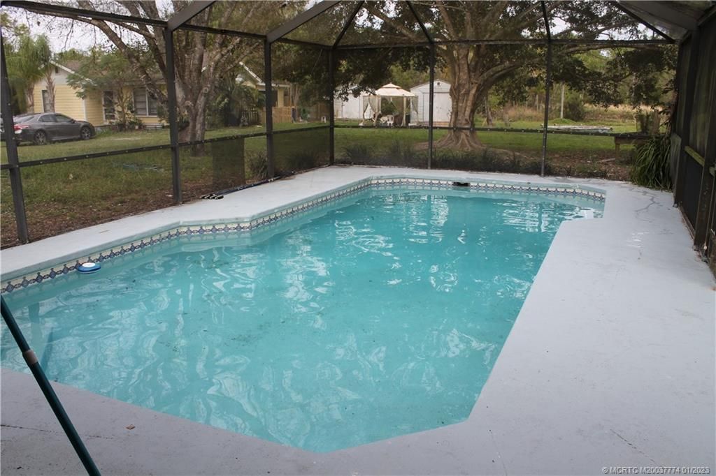 Photo of 7003 SW 39th Street, Palm City, FL 34990 (MLS # M20037774)