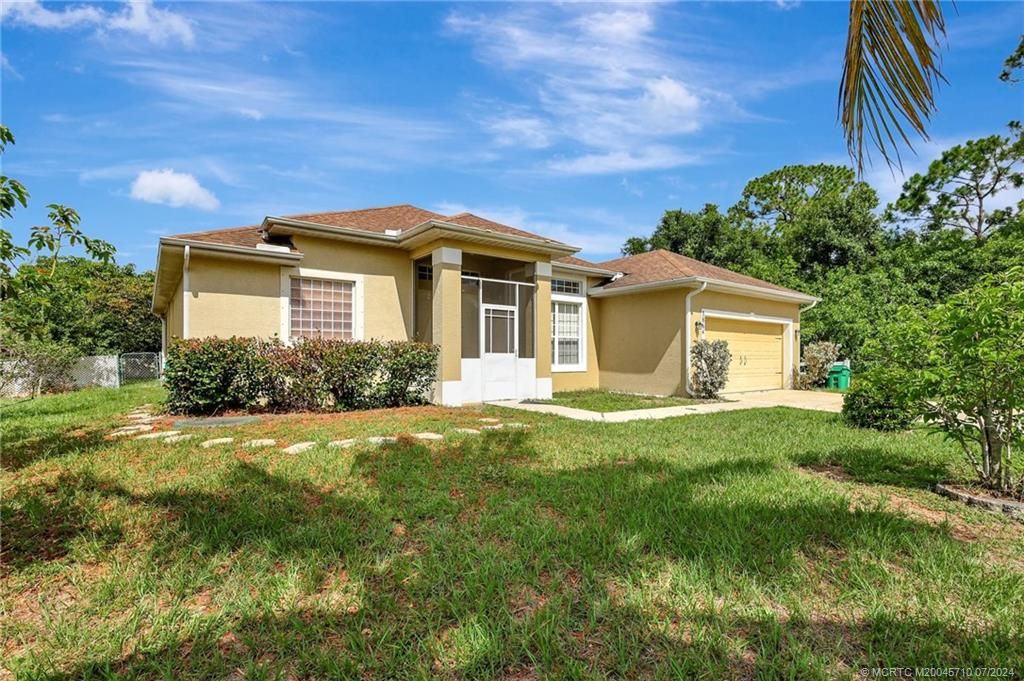 Photo of 3864 SW Wycoff Street, Port Saint Lucie, FL 34953 (MLS # M20045710)