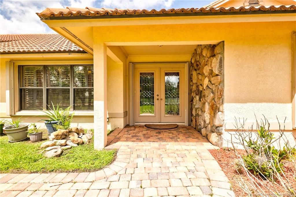 Photo of 9813 Santa Monica Drive SW, Palm City, FL 34990 (MLS # M20040134)