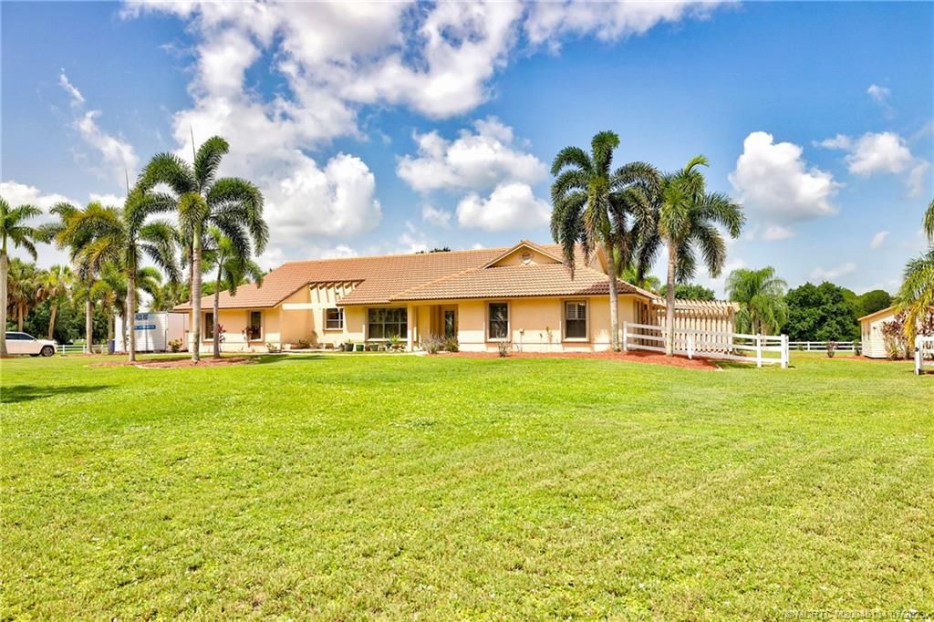 Photo of 9813 Santa Monica Drive SW, Palm City, FL 34990 (MLS # M20040134)