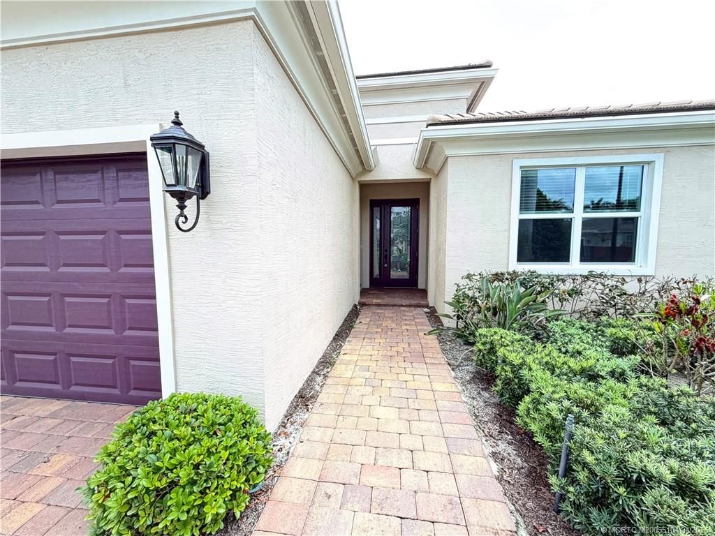 Photo of 8741 SW Vico Way, Port Saint Lucie, FL 34987 (MLS # M20055104)