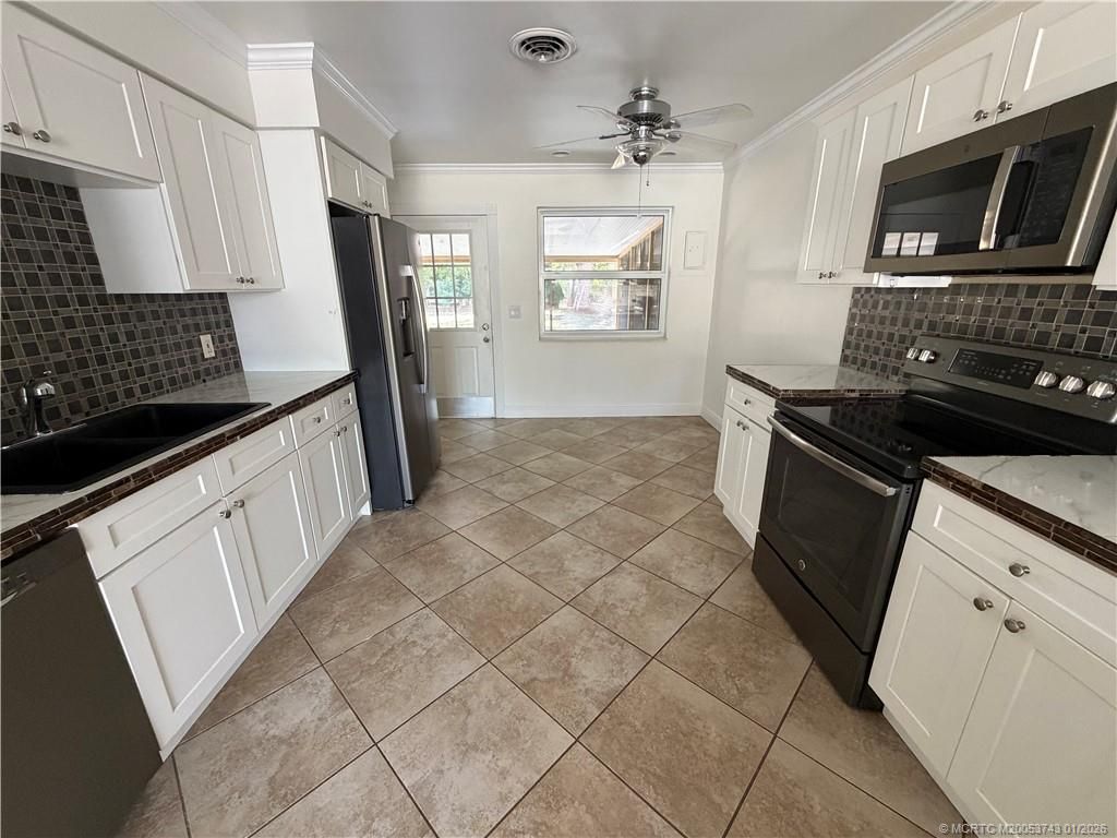 Photo of 820 NW 10th Terrace, Stuart, FL 34994 (MLS # M20053743)