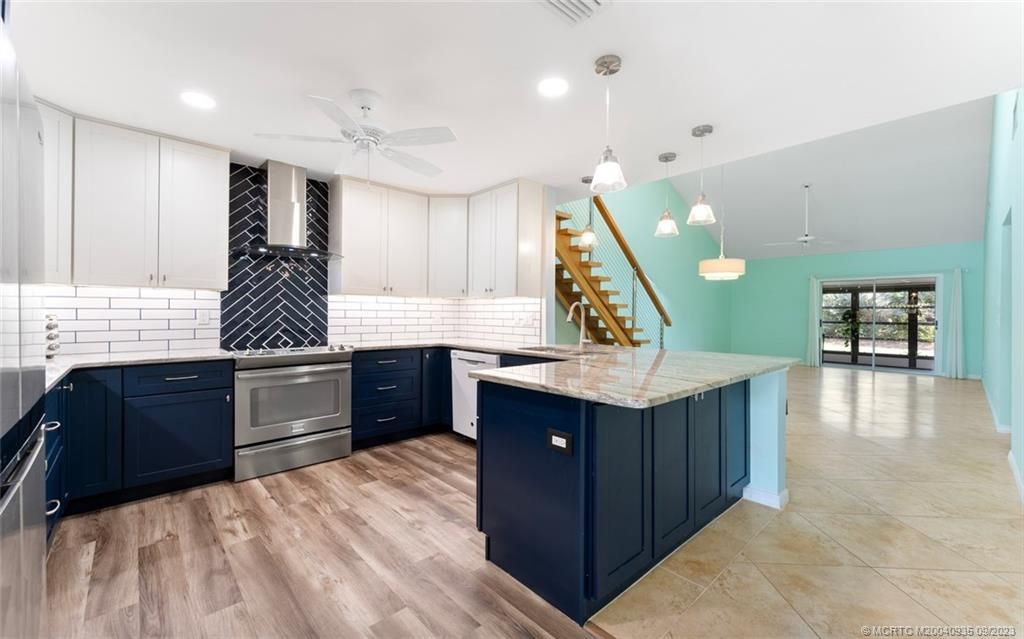 Photo of 915 NE Sandalwood Place, Jensen Beach, FL 34957 (MLS # M20040935)