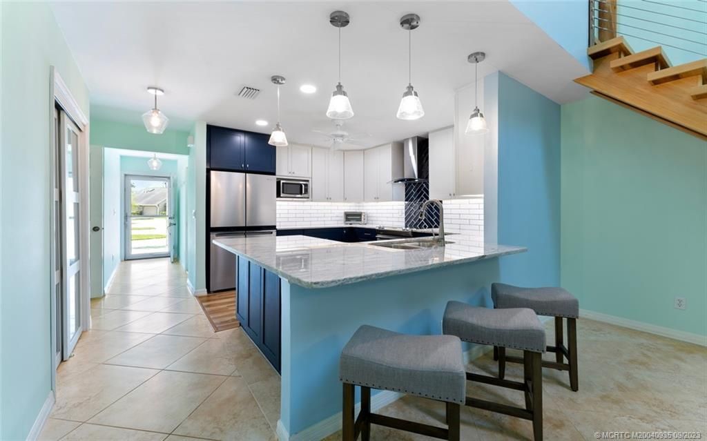 Photo of 915 NE Sandalwood Place, Jensen Beach, FL 34957 (MLS # M20040935)